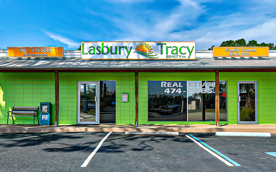 Lasbury Tracy Realty in Englewood Florida - lime green building with orange signage